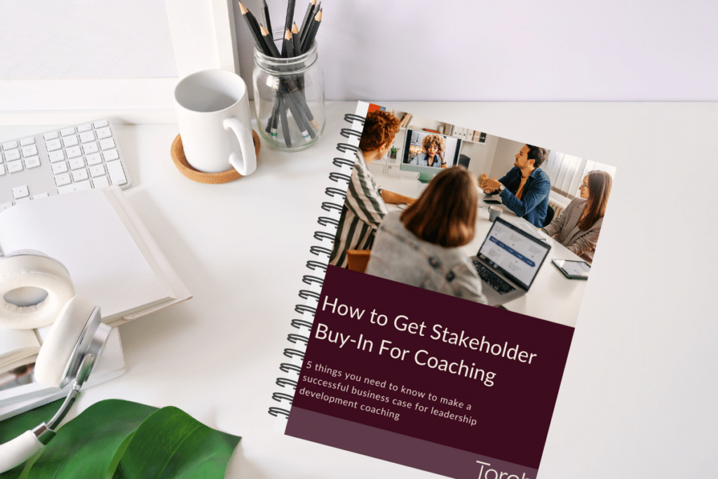 How to get stakeholder buy-in for coaching ebook on a desk