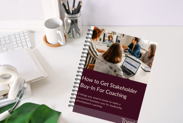 How to get stakeholder buy-in for coaching ebook on a desk